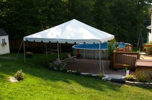 20'x20' Frame Tent Over Patio by Pool