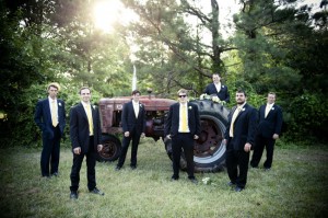 grooms men with tractor