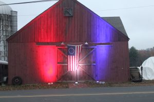 on barn with flag