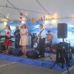 Band on Stage under tent